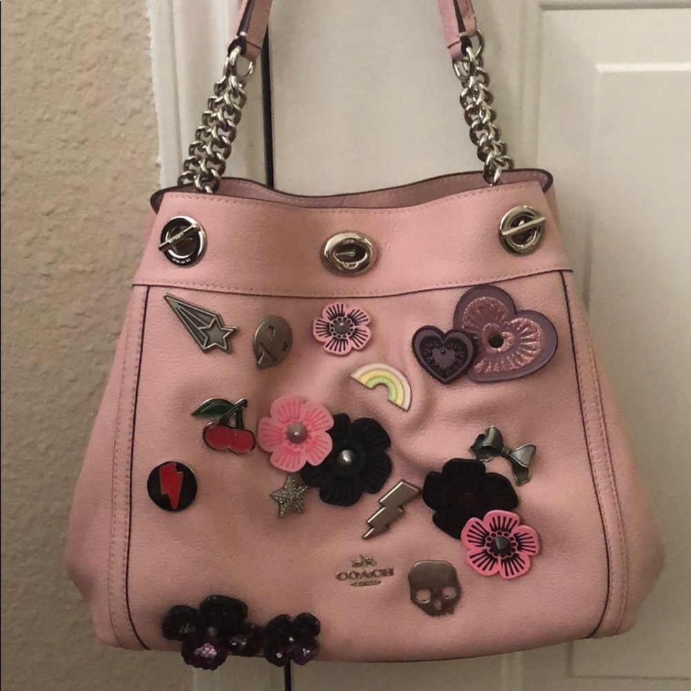 Pink leather Coach purse with Coach buttons